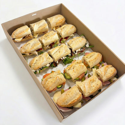 Gourmet French baguette catering box with assorted fillings for corporate lunch delivery in Brisbane CBD.