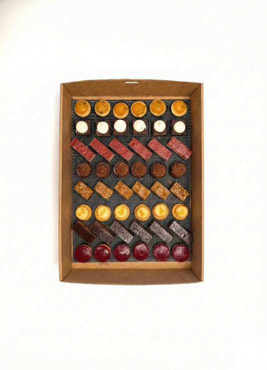 Elegant French petit four dessert platter for weddings, private parties, and high-end corporate functions.