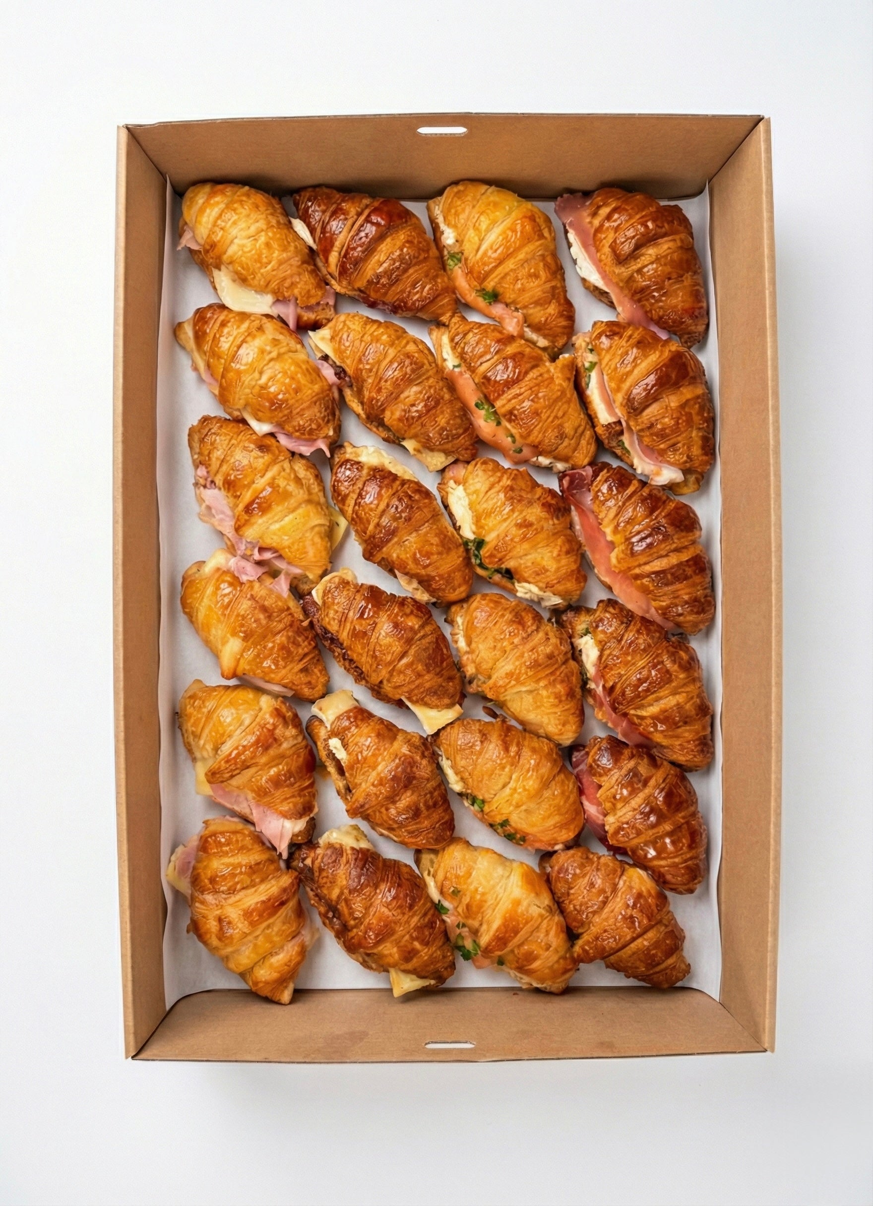 Artisan savoury filled croissants with gourmet French fillings for breakfast catering in Brisbane.